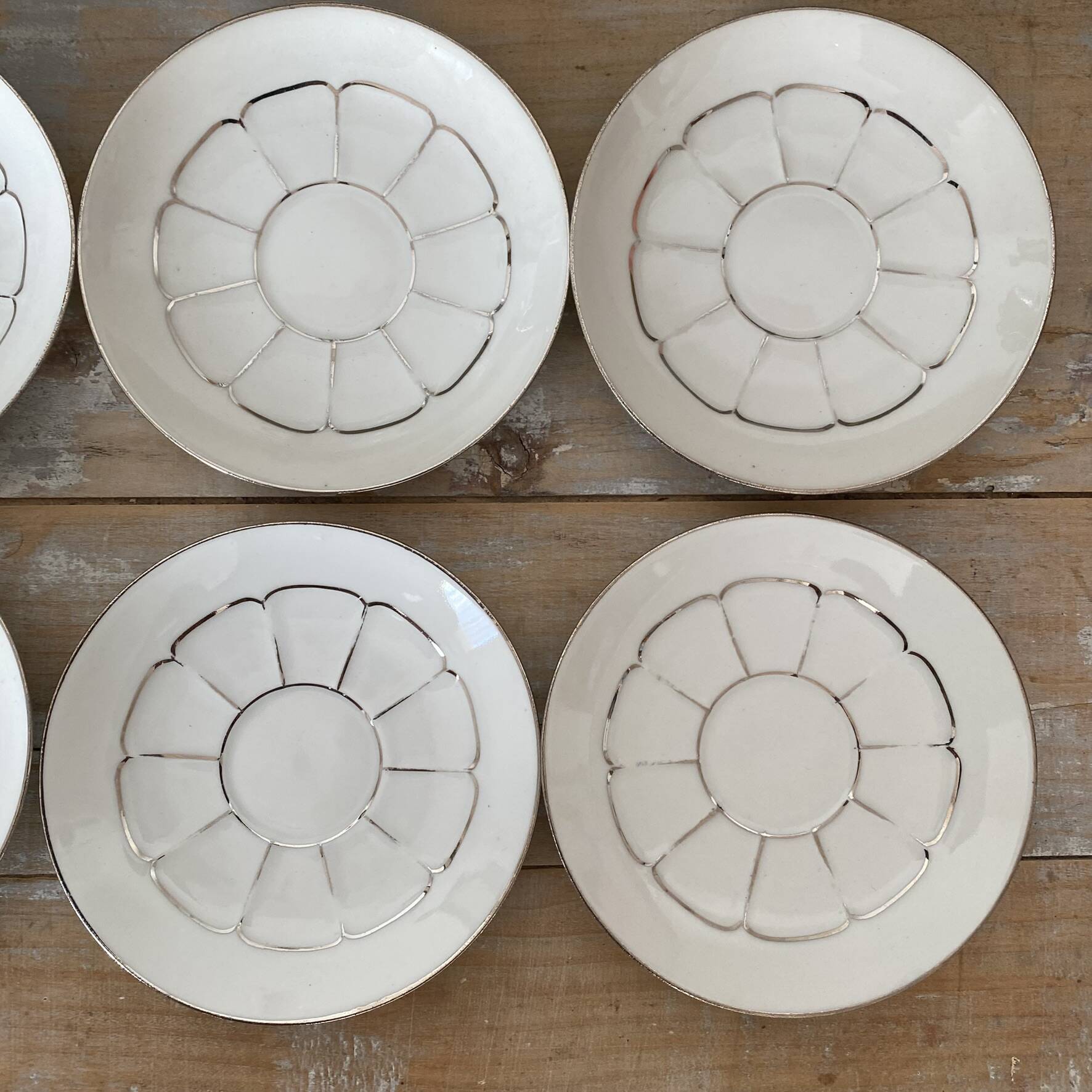White and silver Limoges porcelain coffee cups and saucers.