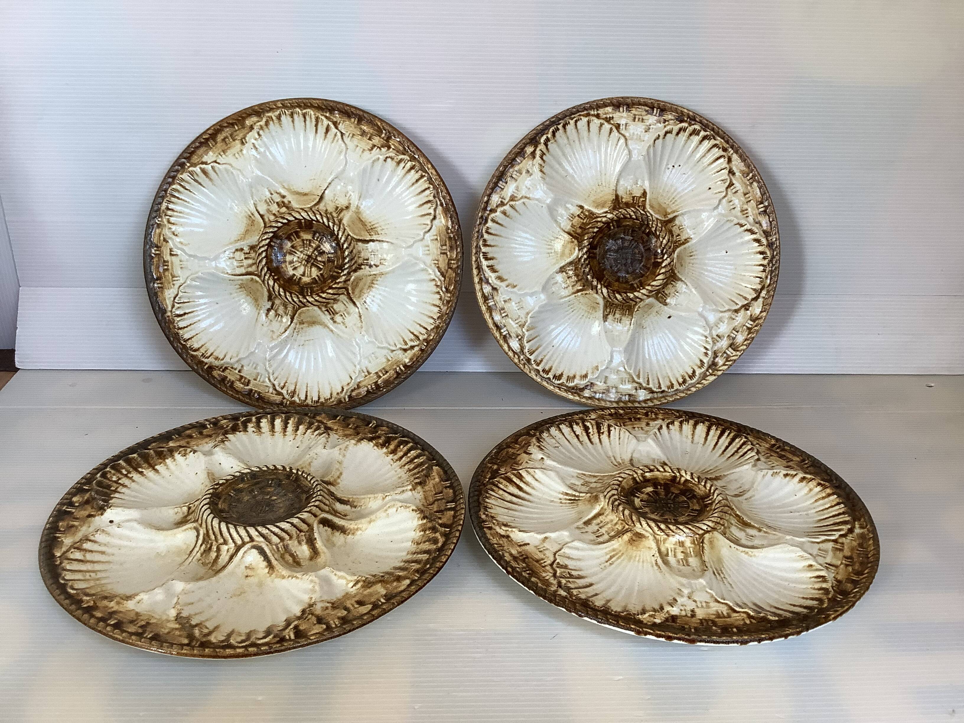 Four old Longchamps oyster plates