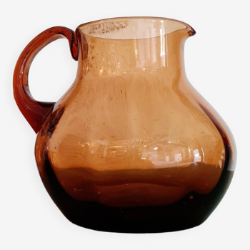 Old amber glass carafe