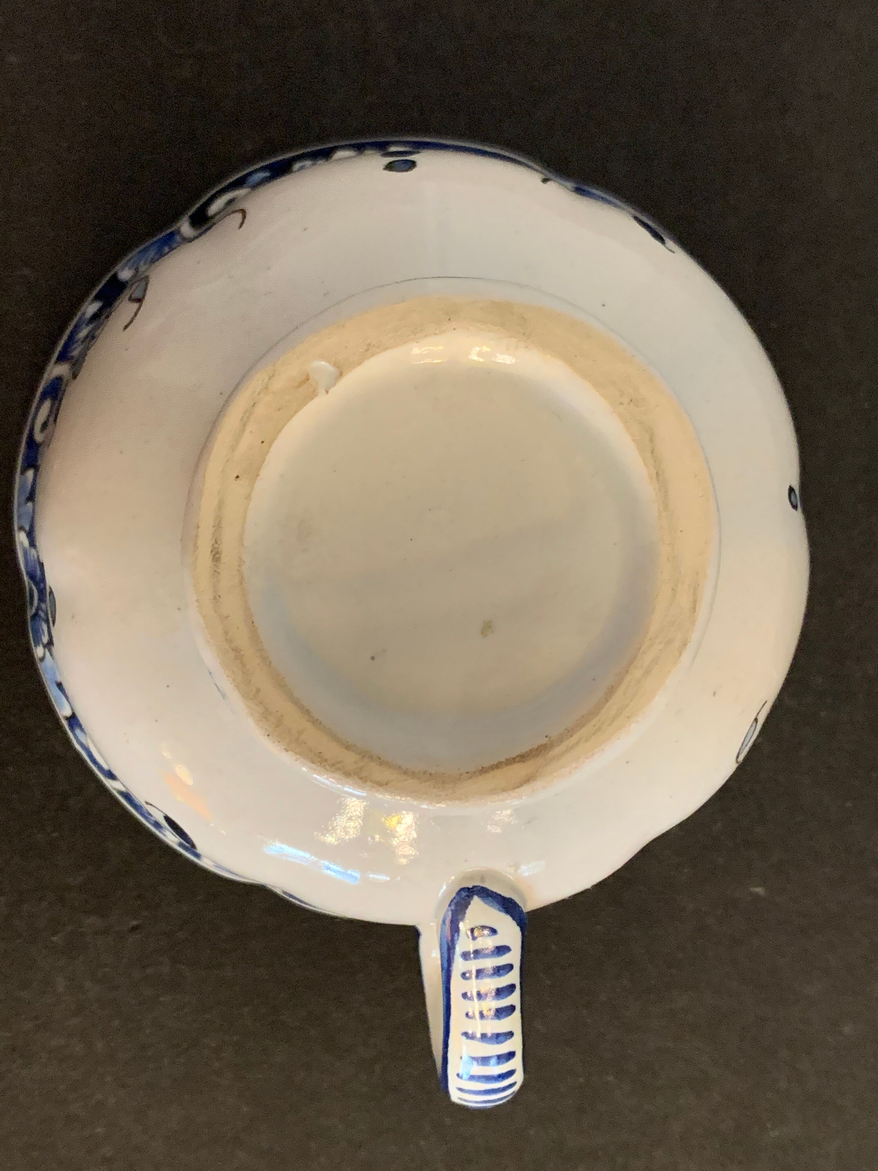 Old mustache cup and its under cup, Rouen earthenware