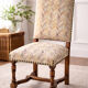 Restored and reupholstered antique chair with character