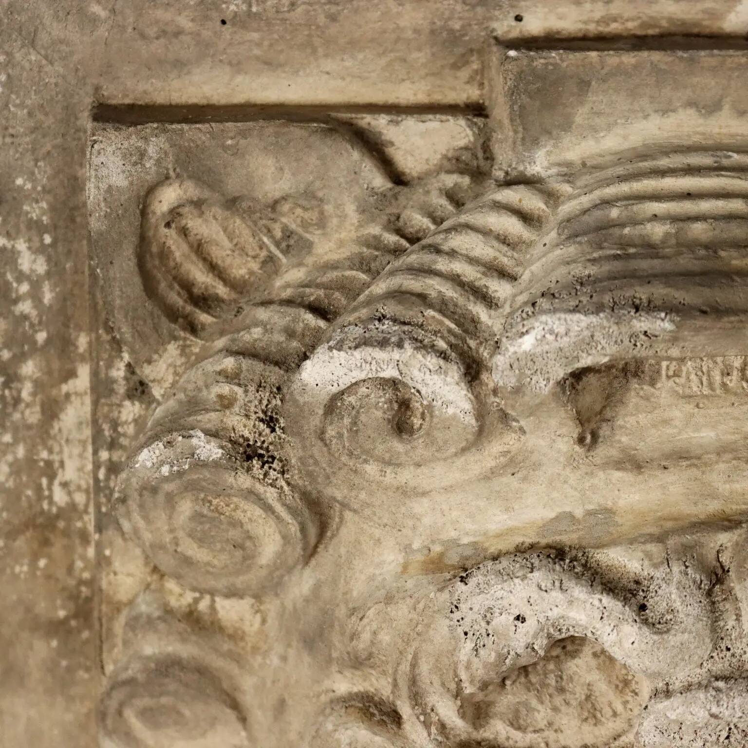 Old plaster tile with a fierce mask decoration, Italy, 19th century.