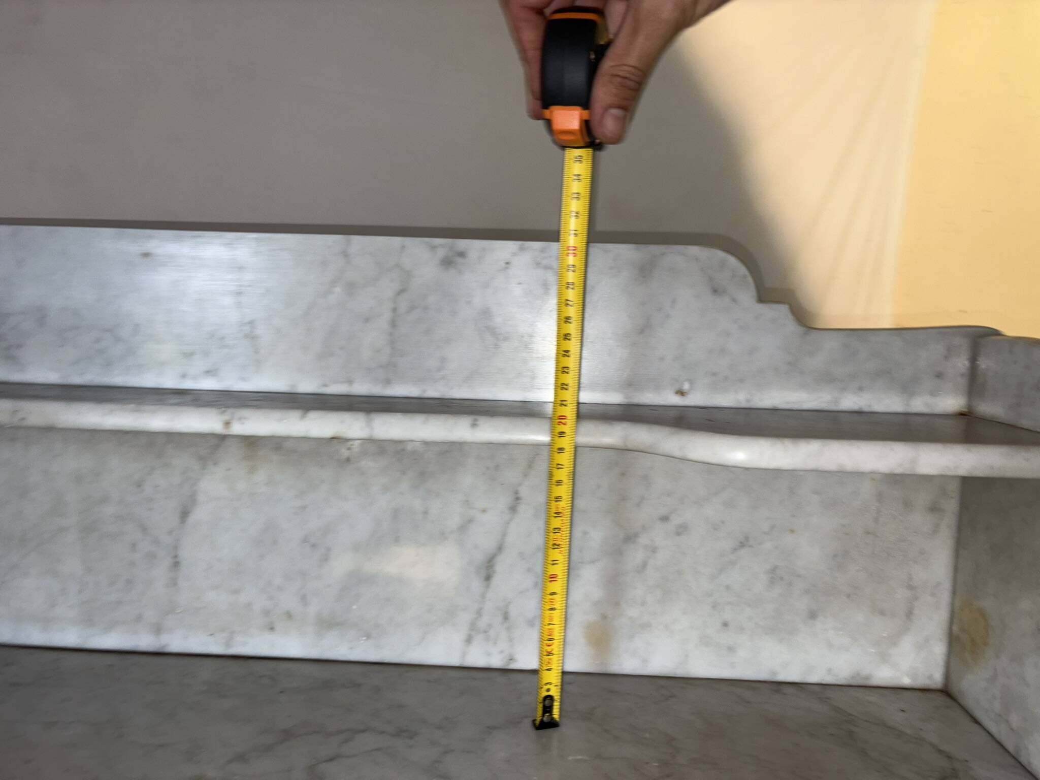 Antique wood and marble kitchen sideboard with carved backsplash