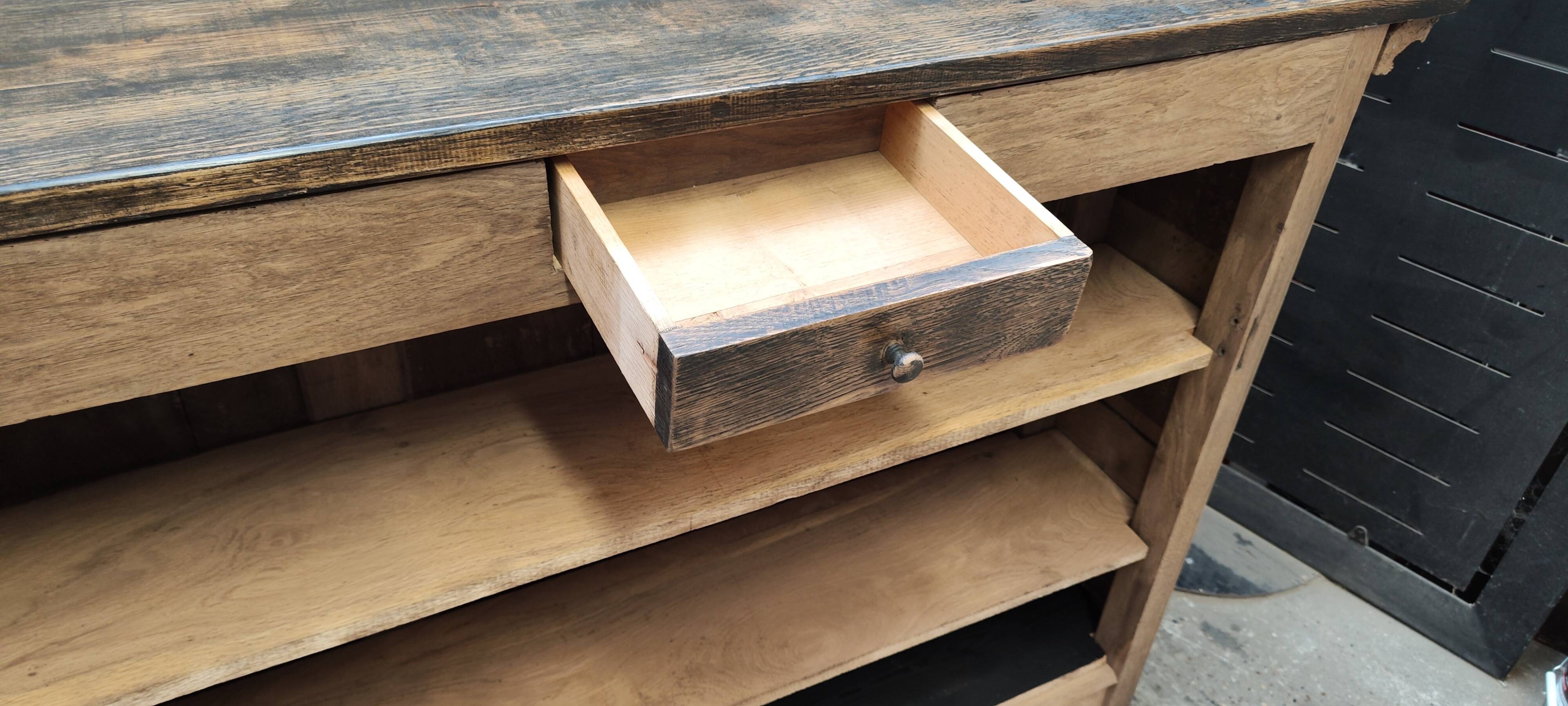 Old raw oak counter with black waxed top