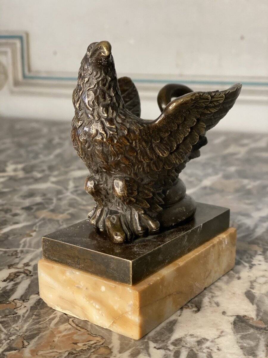 Eagle and serpent, bronze inkwell on a marble base.