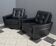 2 Black leather arm chairs 1960s on wheels