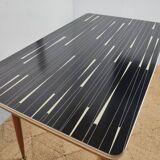 Adjustable vintage table with formica extension cords
