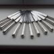 12 couteaux Art déco anciens métal argenté et lames acier fondu