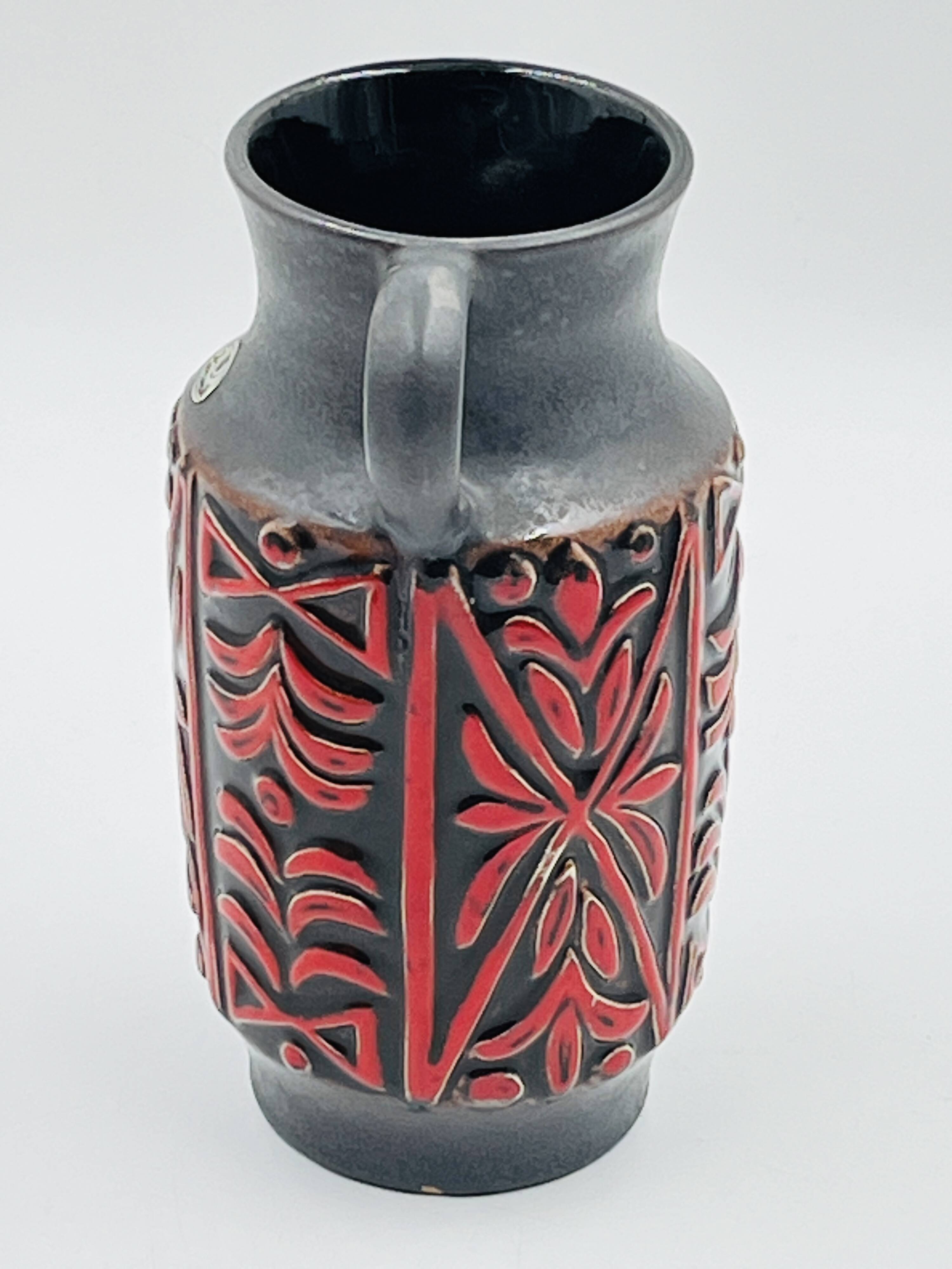 Vase West Germany, ceramic relief, red, 1970s.