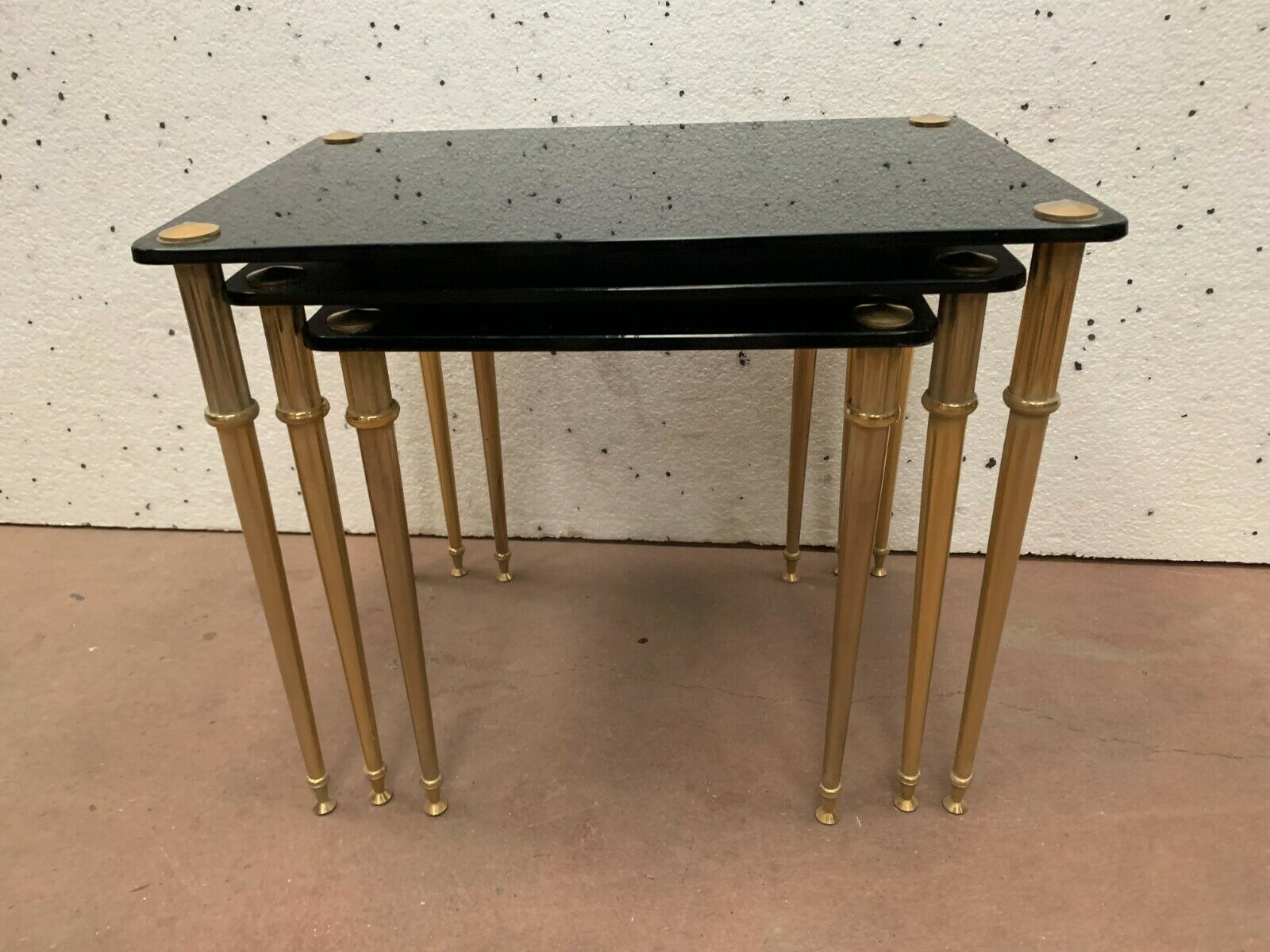 Pull out tables in brass and black glass XX century