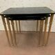 Pull out tables in brass and black glass XX century