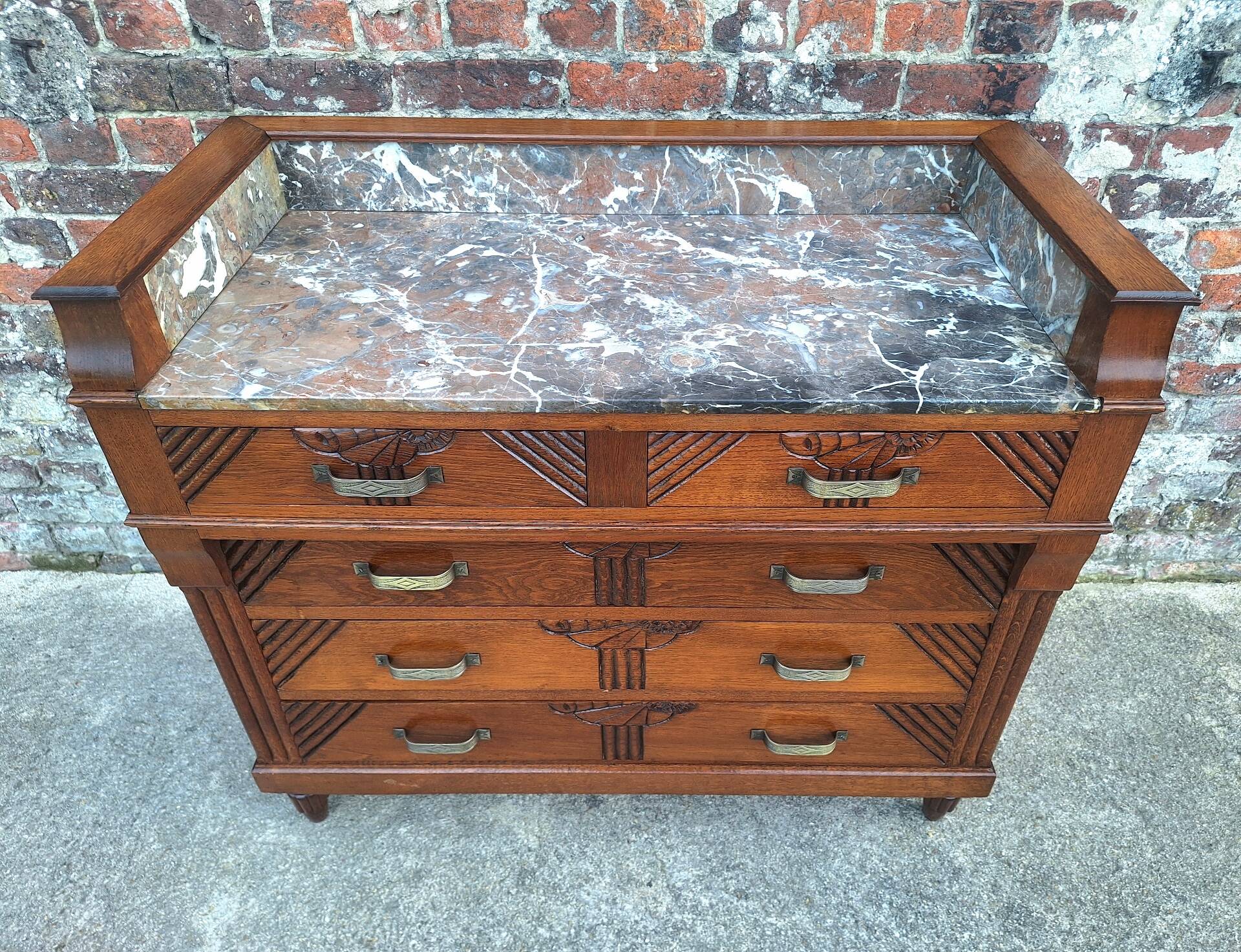 Art Deco commode with marble top, vintage antique furniture.