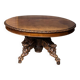 Large extendable dining table in hunting style with four fox figures on the leg.