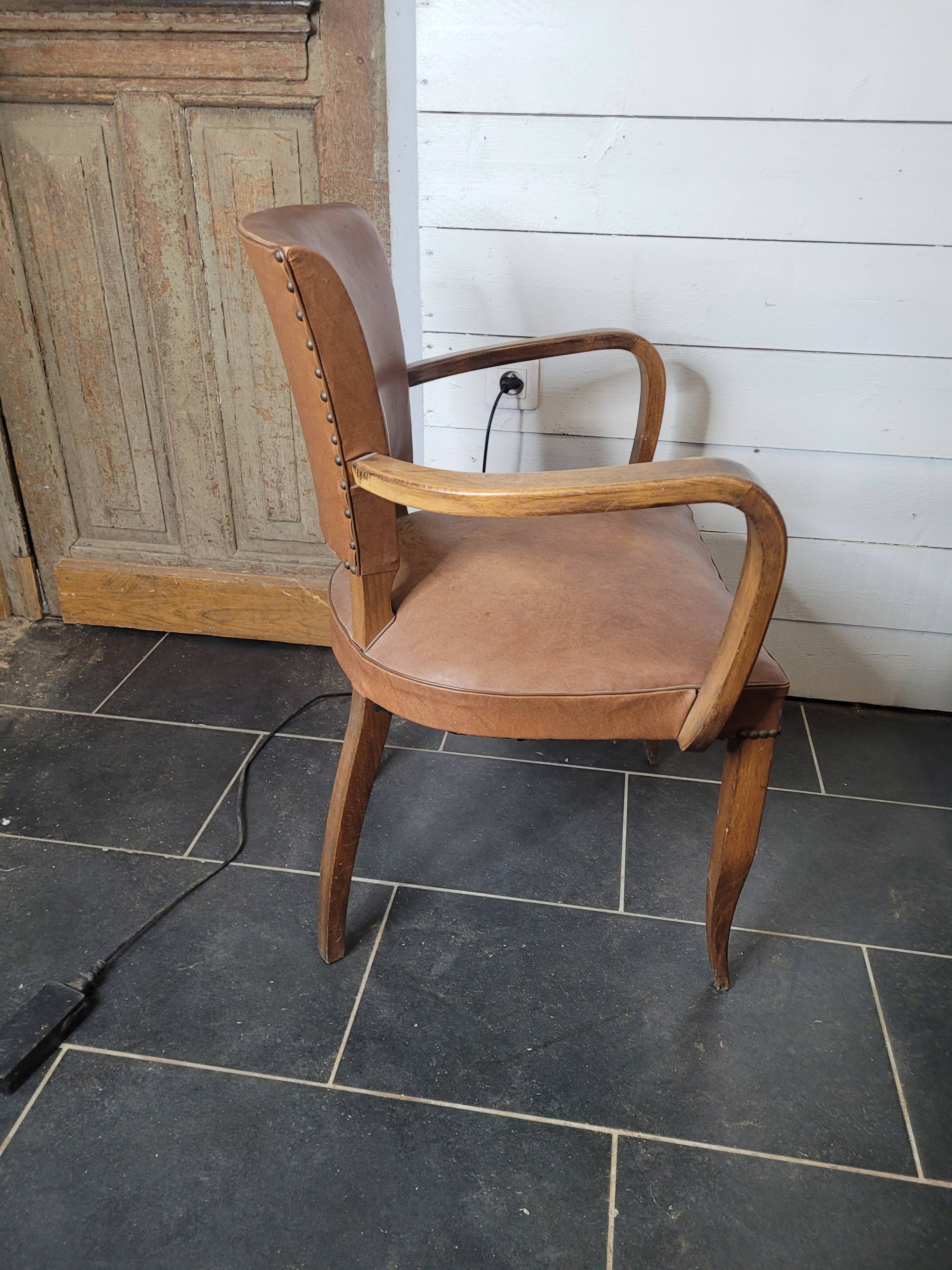 Bridge armchair in skai from the 60s