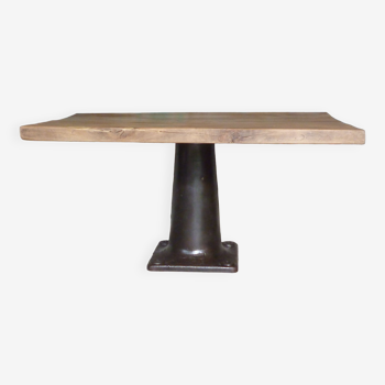 Industrial design table with central cast iron base