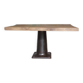 Industrial design table with central cast iron base