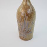 Brown ceramic/stoneware bottle with chiseled floral pattern