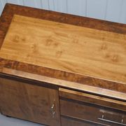 Walnut Burr buffet with drawers and wheels, part of a set.