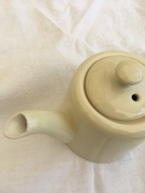 "Selfish" cream-colored teapot