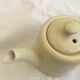 "Selfish" cream-colored teapot