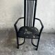 Set of 6 black lacquered wooden dining chairs with high backs and patterned fabric seats, 1980s.