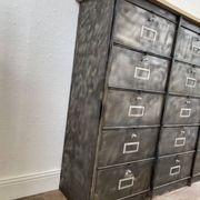 Metal furniture with 15 renovated roneo flaps.