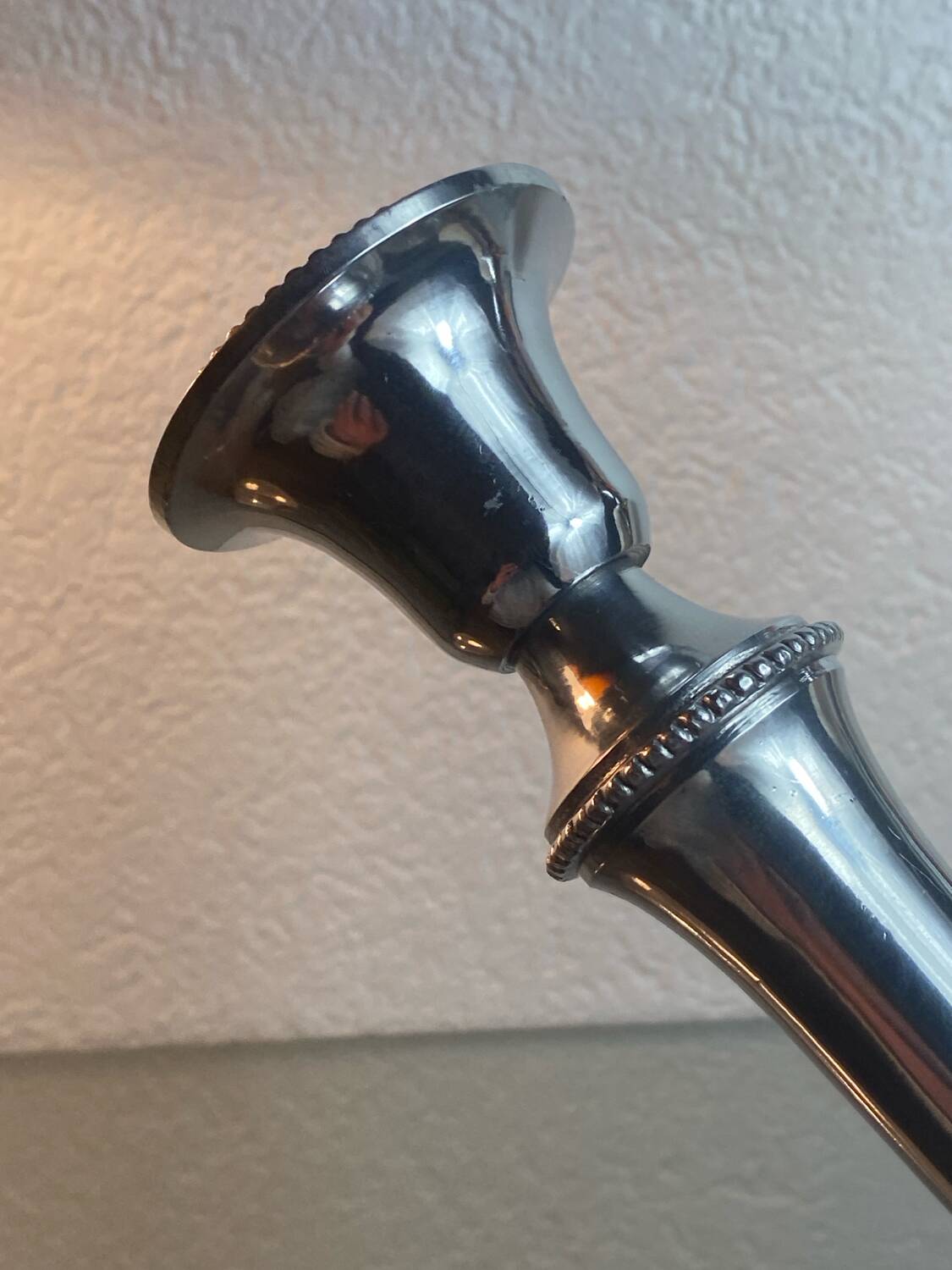 Pair of silver-plated metal candlesticks