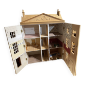 Large wooden dollhouse with miniature furniture