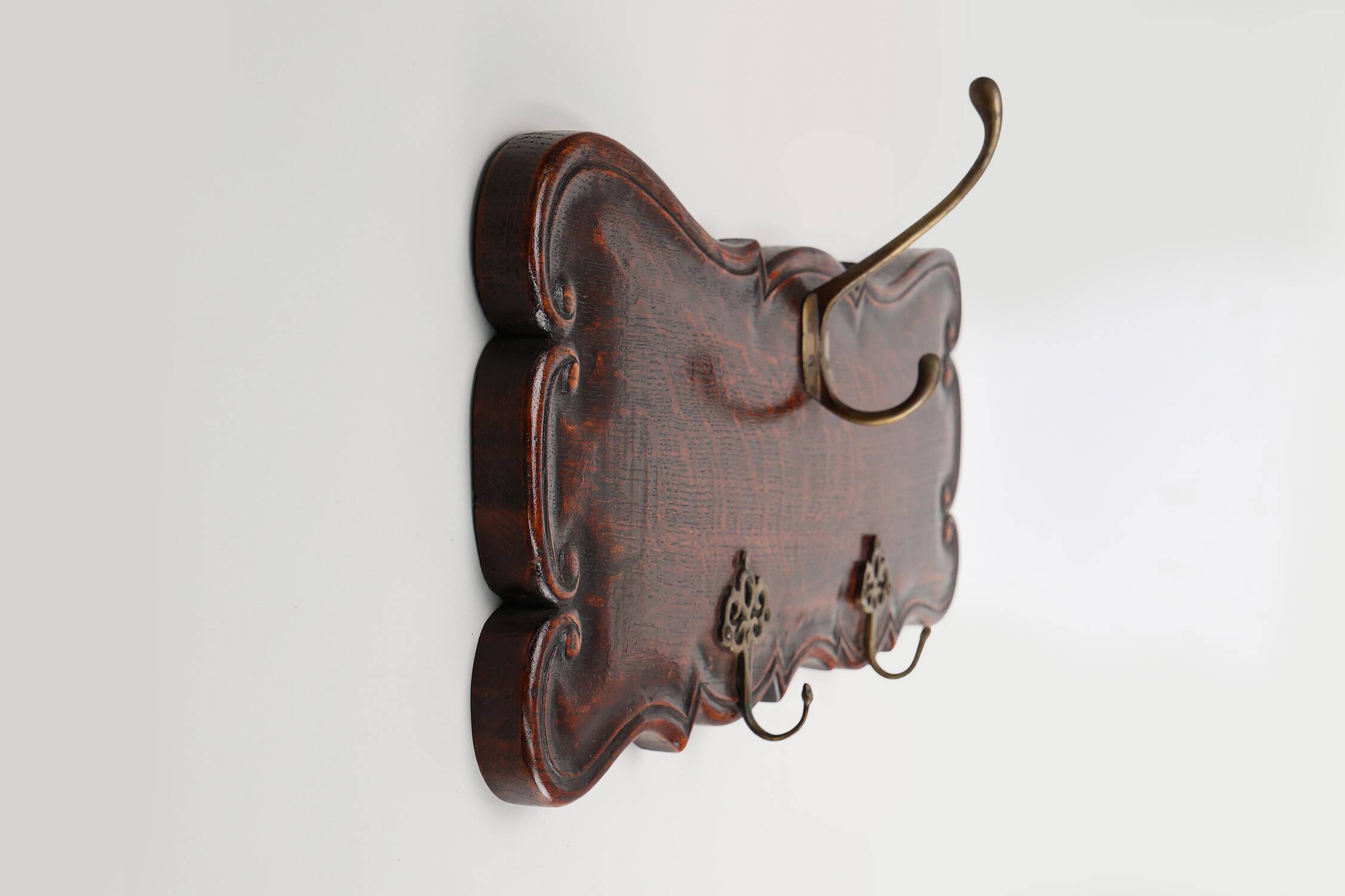 Art Nouveau style coat rack in oak with brass hooks, France ca. 1915