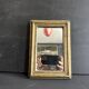 Miniature mirror from the 18th century in gilded wood, mercury glass.