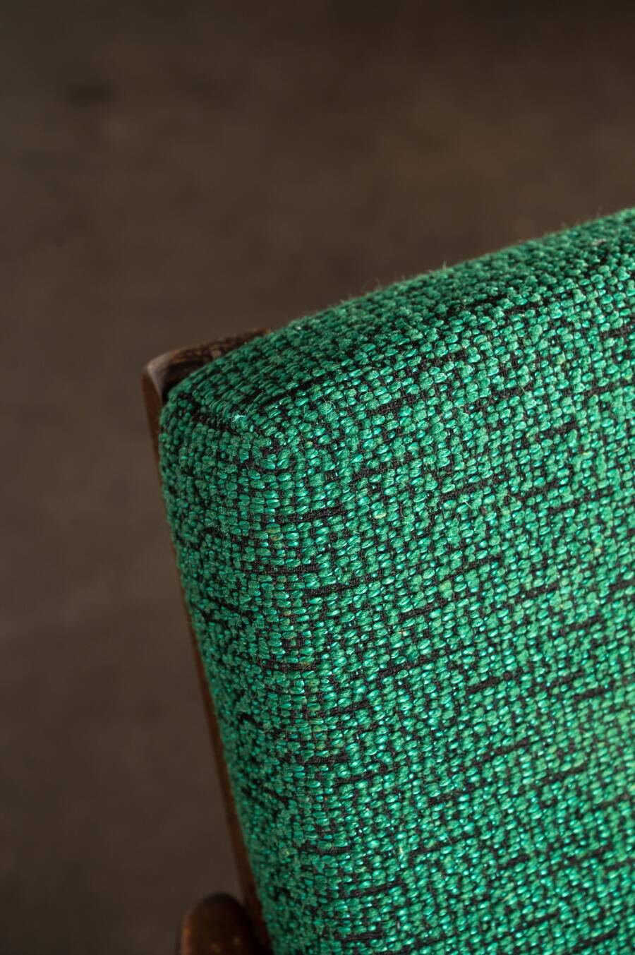 Boomerang chair in green fabric