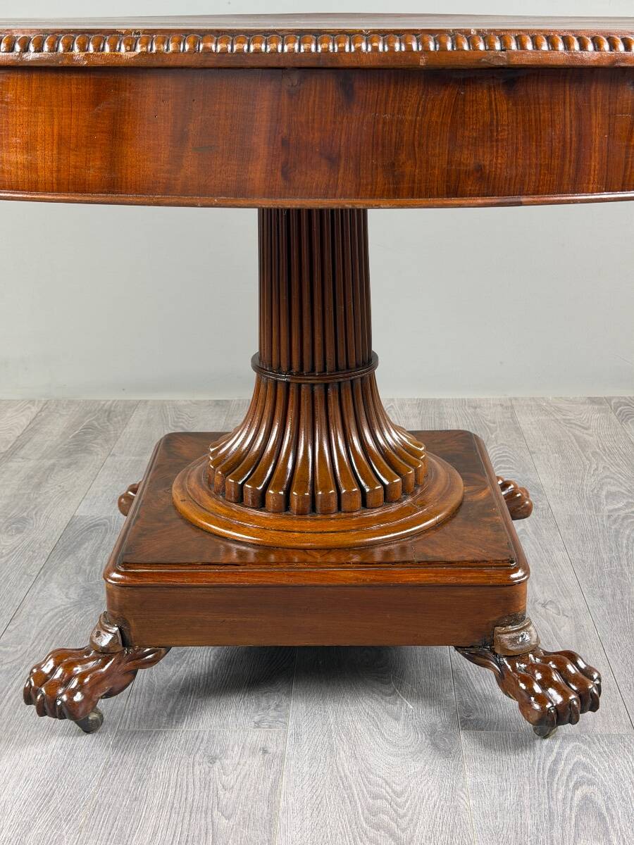 Oval Empire-style table with a central pedestal, 19th century.
