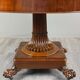 Oval Empire-style table with a central pedestal, 19th century.