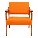 Vintage armchair in papaya orange wool from the 1960s.