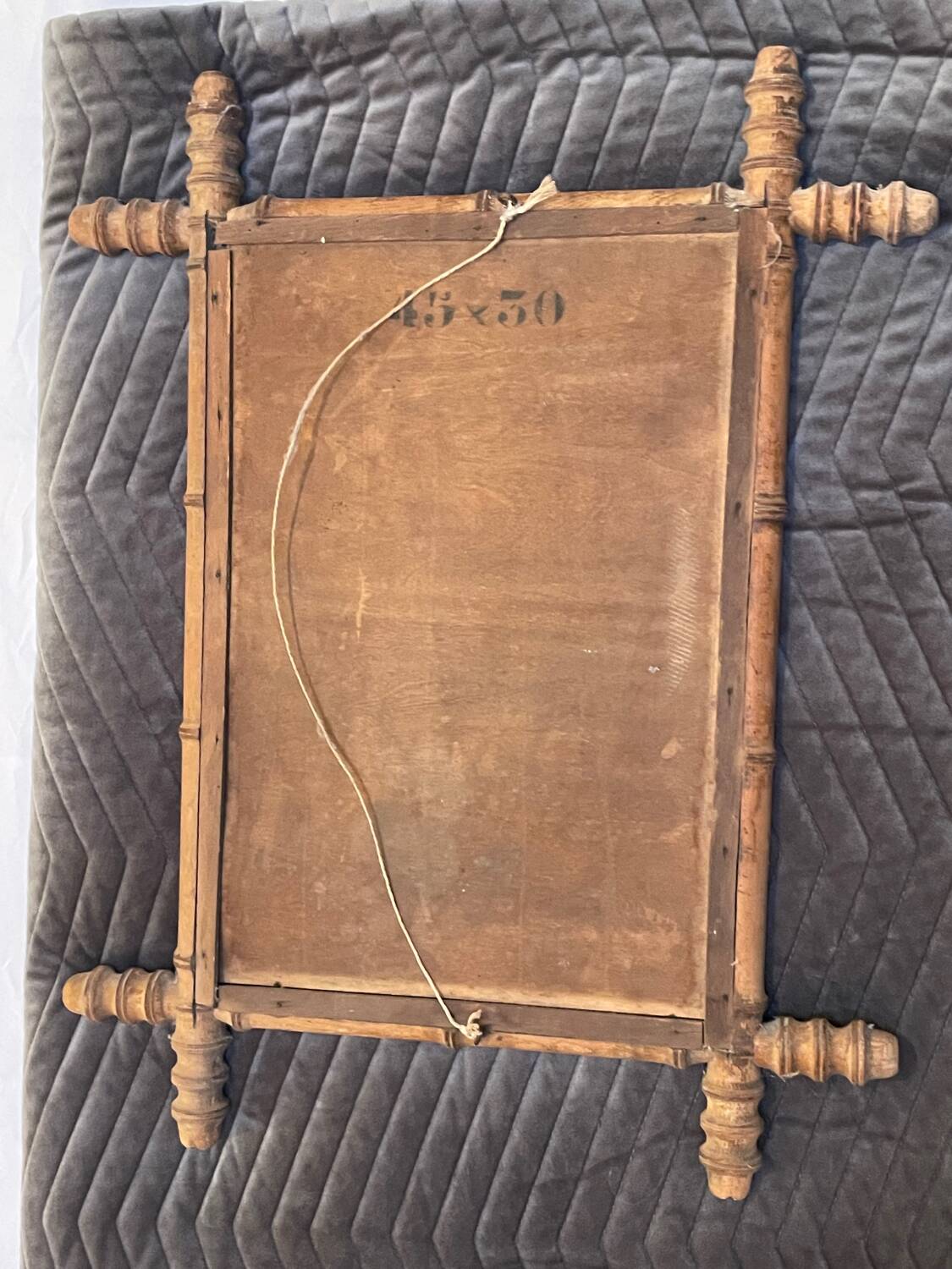 Carved wooden mirror in a bamboo style