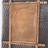 Carved wooden mirror in a bamboo style