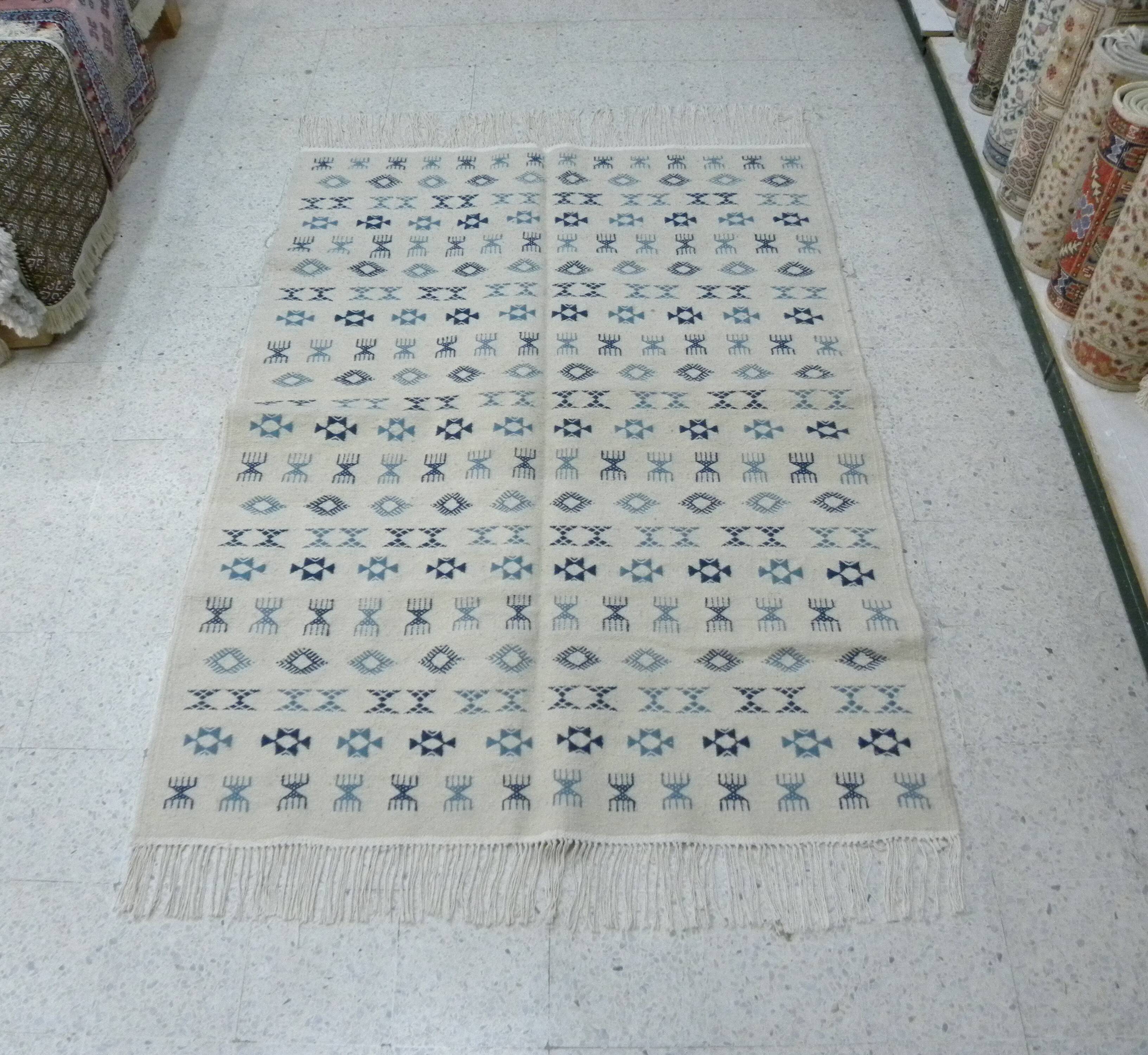 Nomadic Tunisian Berber rug, margoum kilim, ethnic in beige and blue wool.