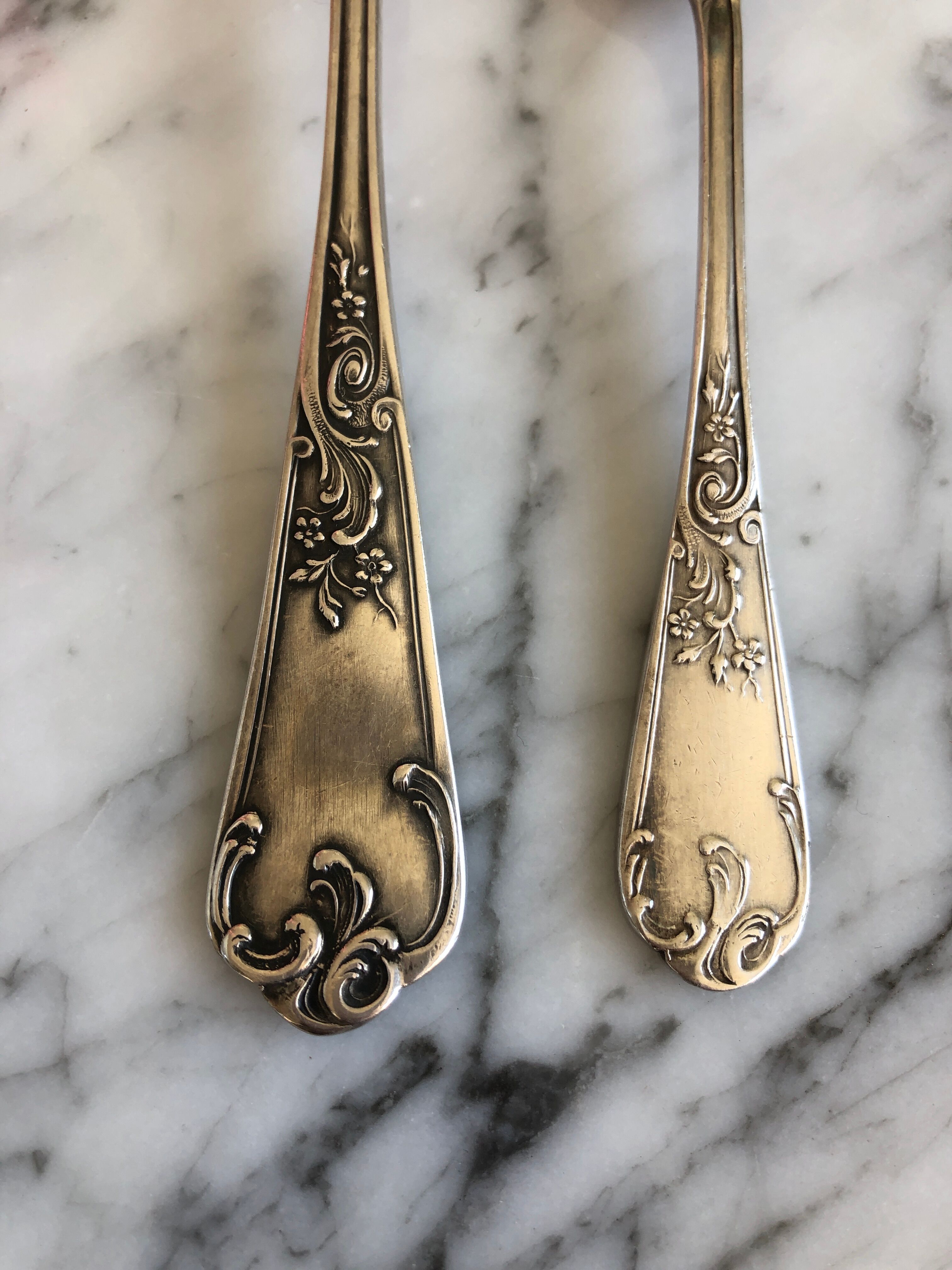 Duo of silver metal spoons