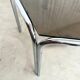 Vintage hexagonal table with smoked glass top and chrome metal structure.