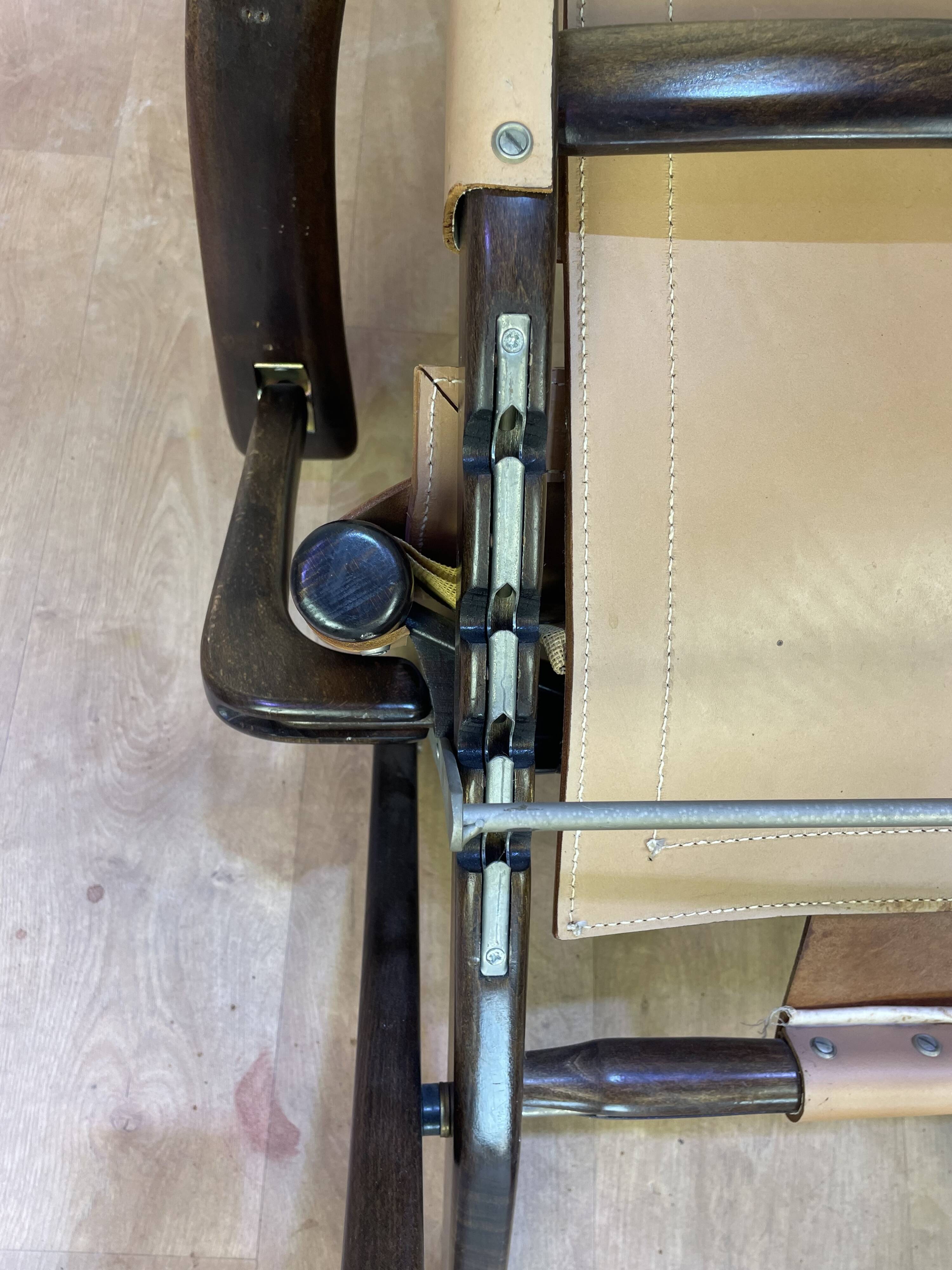 Colonial style leather armchair and ottoman