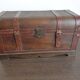 Wooden trunk with leather and metal, ultra chic and elegant in a living room or bedroom.