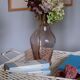 Blown glass vase moves purple