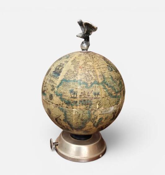 Vintage globe bar service with its liqueur bottle.