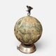 Vintage globe bar service with its liqueur bottle.