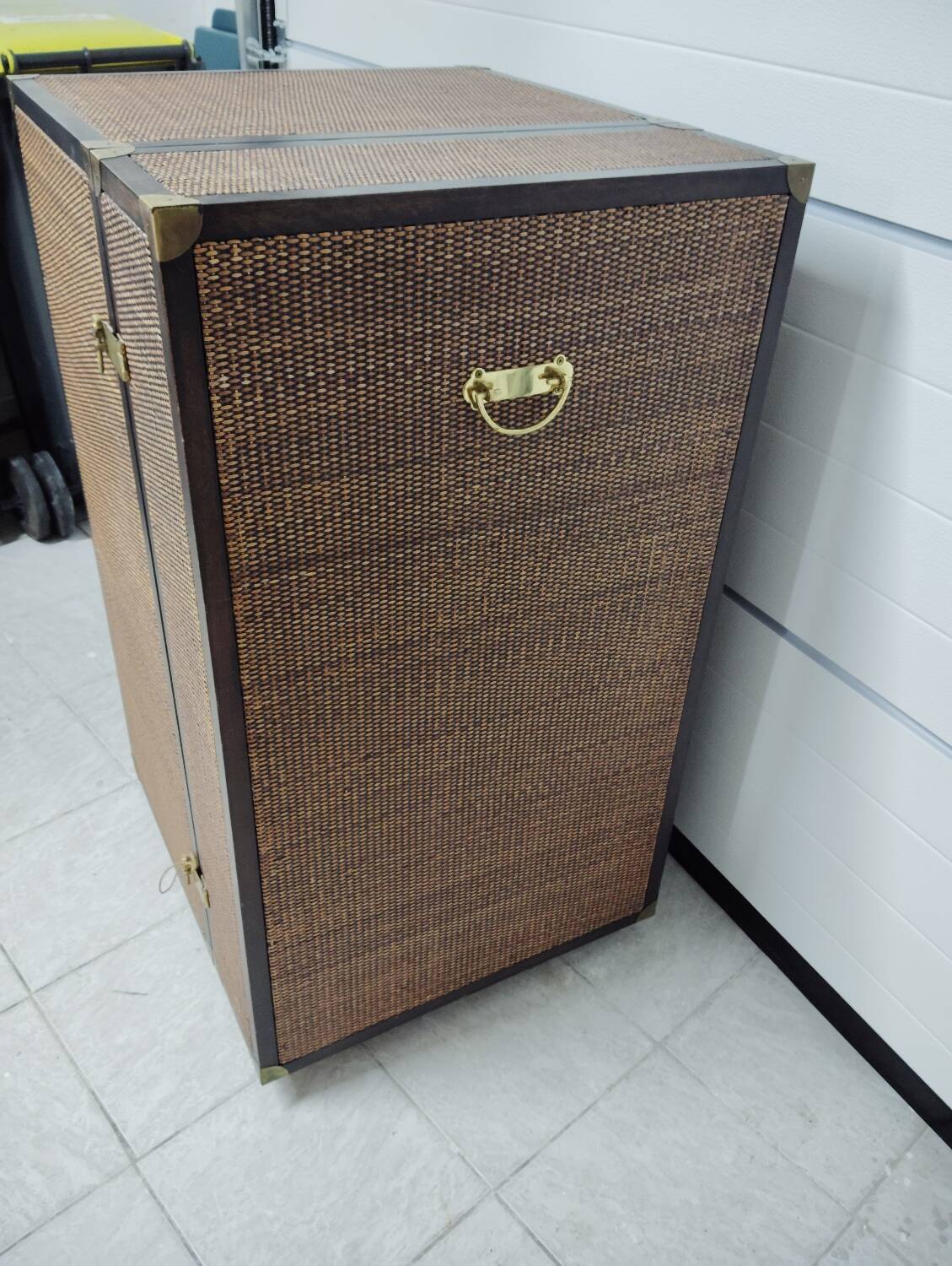 Wardrobe trunk on casters in mahogany and woven rattan.