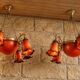 Pair of Art Nouveau style chandeliers in bronze and orange glass paste.