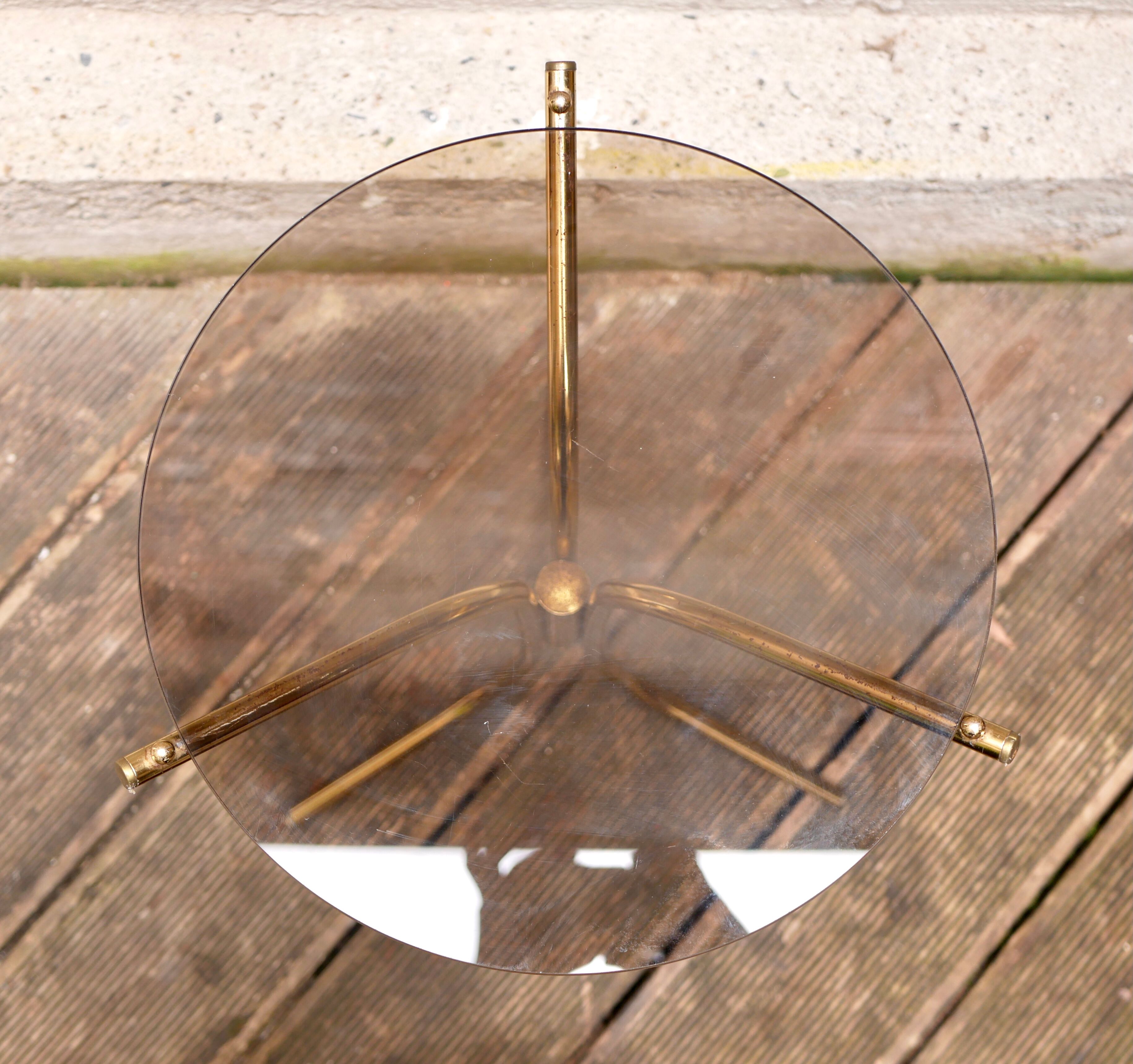Golden pedestal table in smoked glass