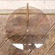 Golden pedestal table in smoked glass