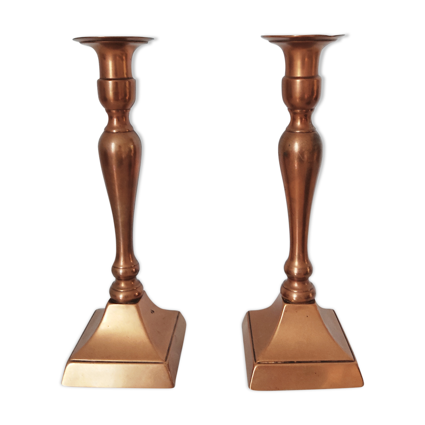 Set of a pair of candle holders and a hand candle holder