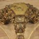 Italian lacquered and gilded round coffee table with glass top